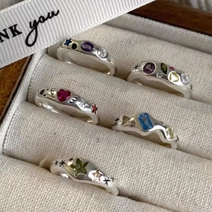 5-piece silver heart and star rings set with colorful zircons on beige fabric box