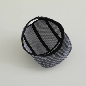 Detailed interior of striped baby cap featuring reinforced seams and fabric quality