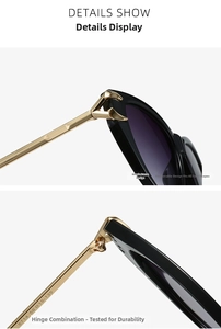 Detail showing the sturdy metal hinge and golden temples of the black cat-eye sunglasses
