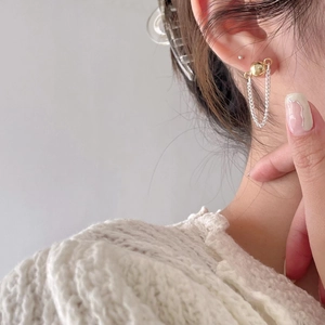 Minimalist S925 sterling silver chain hoop earrings with a gold ball pendant on a model