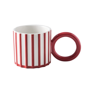 Creative ceramic coffee mug with vertical red and white stripes and a thick red handle