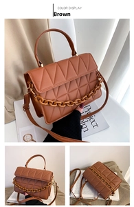 Détail d'un sac à main marron matelassé en similicuir avec chaîne et bandoulière