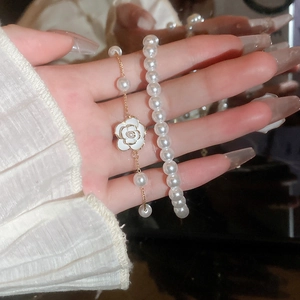 Elegant 2-piece gold plated pearl bracelet set with camellia floral charms for women