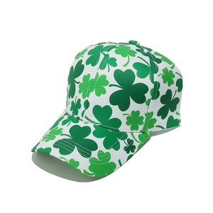 Detailed top view of a white baseball cap with green shamrock prints for Saint Patrick's Day