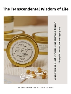 Close-up of handmade soy wax candle in premium gold tin with minimalist vintage label