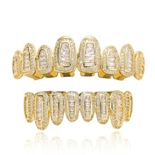 Macro view of gold hip-hop grillz with sparkling zircon stones and reflective finish