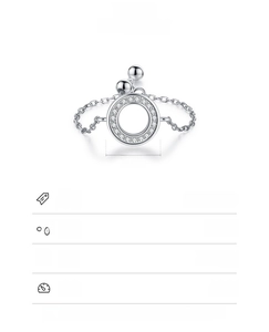 Macro view of 925 sterling silver chain ring with pave zircon open circle detail