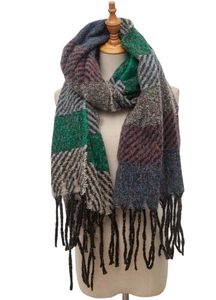 Close-up of thick knit striped scarf with fringes and colorful herringbone texture