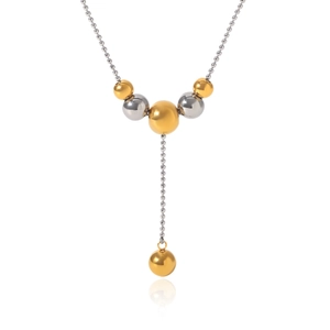 Detail view of 18K gold and silver two-tone beaded Y-shaped stainless steel tassel necklace