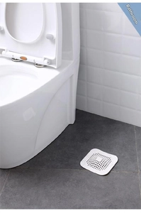 Close-up of white square silicone drain cover with fine mesh for hair filtering
