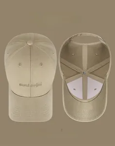 Detail of khaki cotton baseball cap showing gold letter embroidery and interior construction