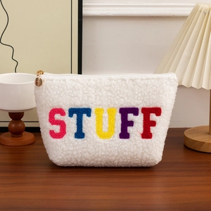 Large plush embroidery STUFF cosmetic bag in white fleece with colorful letters