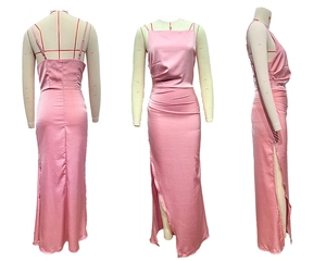 Pink satin slip dress detail featuring delicate spaghetti straps and side leg slit