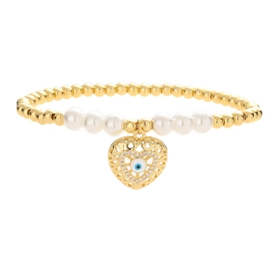Elastic beaded bracelet featuring white pearls, gold beads and a heart evil eye charm