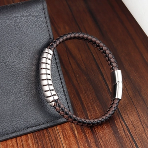 Mens vintage woven leather bracelet with brown and black cords and silver metal rings