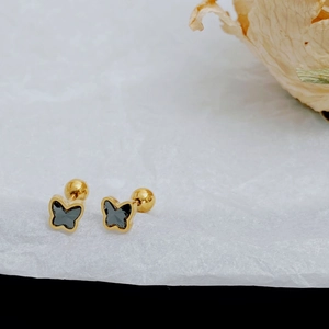 Detail of gold butterfly stud earrings with black inlay and secure screw ball backs