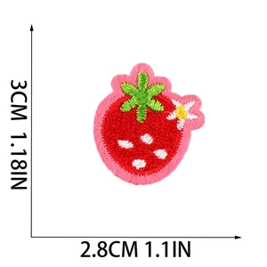 Detailed size view of strawberry embroidery patch with white floral accents 3cm x 2.8cm