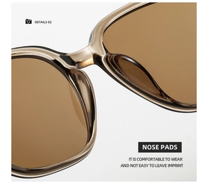 Detail of comfortable nose pads on tawny square sunglasses with a wood grain texture