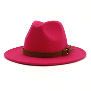 Detail of rose red fedora hat with brown suede belt and golden metal buckle