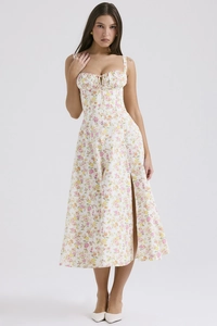 Detail view of floral strap dress with ruching on the bust and a high side slit