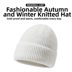 Close-up of a white knit beanie with thick ribbed texture for winter warmth