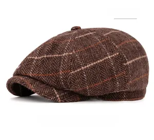 Detailed view of coffee brown herringbone newsboy hat with textured wool fabric