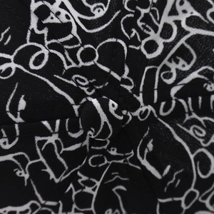 Macro shot of cotton baseball cap with white artistic line art and twill fabric texture