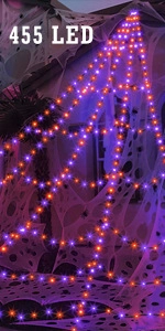 Outdoor Halloween spider web decoration featuring 455 LED purple and orange lights
