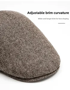 Detailed knit texture of a brown winter beret featuring a foldable wide brim design