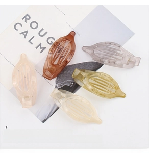 Set of five oval matte hair clips in amber, gray, olive, cream, and pink tones