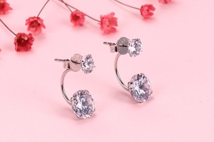 Detailed macro view of S925 sterling silver hallmark on crystal double zircon stud earrings