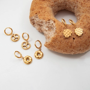 Gold plated stainless steel hoop earrings with unique food-shaped pendants like donuts