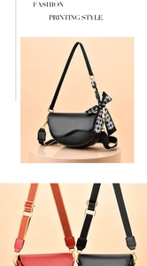 Close-up of saddle bag with patterned silk scarf and adjustable wide shoulder straps