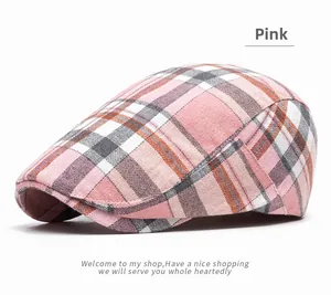 Detail of pink plaid flat cap showing high-quality fabric texture and neat stitching