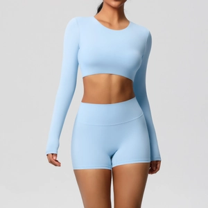Detail of light blue brushed long sleeve yoga top and high waist sports shorts set