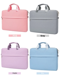 Minimalist laptop bags in pink, grey, purple and blue showing handles and front zip pockets