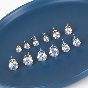 Classic round cubic zirconia stud earrings in various sizes with gold and silver bases