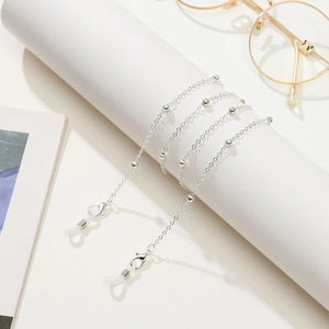 Detail of silver beaded eyeglass chain with lobster clasps and silicone loops