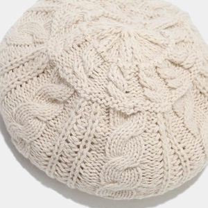 Women's cable knit beige beret hat with detailed braided pattern in soft wool finish
