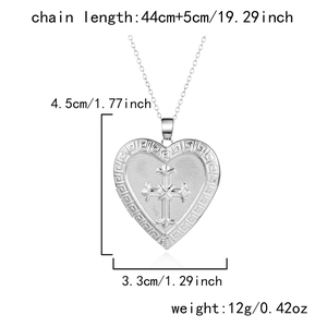 Silver heart locket necklace with cross design and engraved Greek key border and dimensions