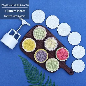 Detail of 100g round mooncake mold set with hand-press handle and 6 floral stamps