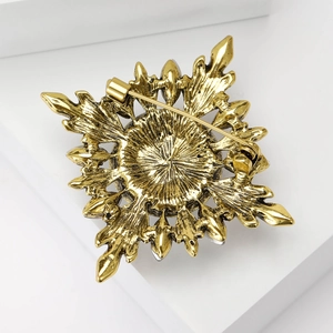 Baroque sunflower brooch in vintage gold finish with detailed metal relief on back side