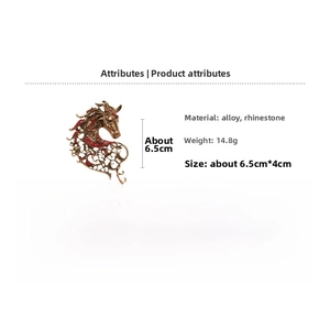 Detailed close-up of retro horse brooch with red rhinestones and bronze alloy finish