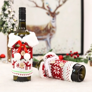 Festive knitted Christmas wine bottle covers with faux fur collars and snowflake patterns
