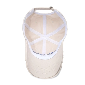 Vintage beige cotton baseball cap with blue embroidery and distressed brim details