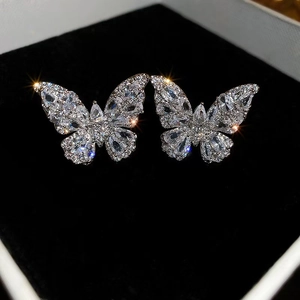 Sparkling silver butterfly zircon earrings displayed in a black velvet jewelry gift box