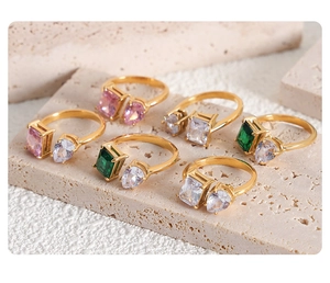 Detailed view of gold-plated titanium steel open rings with colorful zircon gemstones