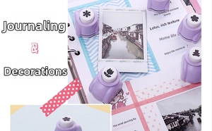 Close-up of purple paper punch tools with snowflake and bear patterns for DIY journaling