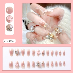 Detailed view of 24pcs pink gradient press-on nails with 3D roses, pearls and rhinestones