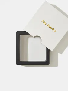 Detail of a black 3D floating jewelry display box with a white 'Fine Jewelry' sleeve